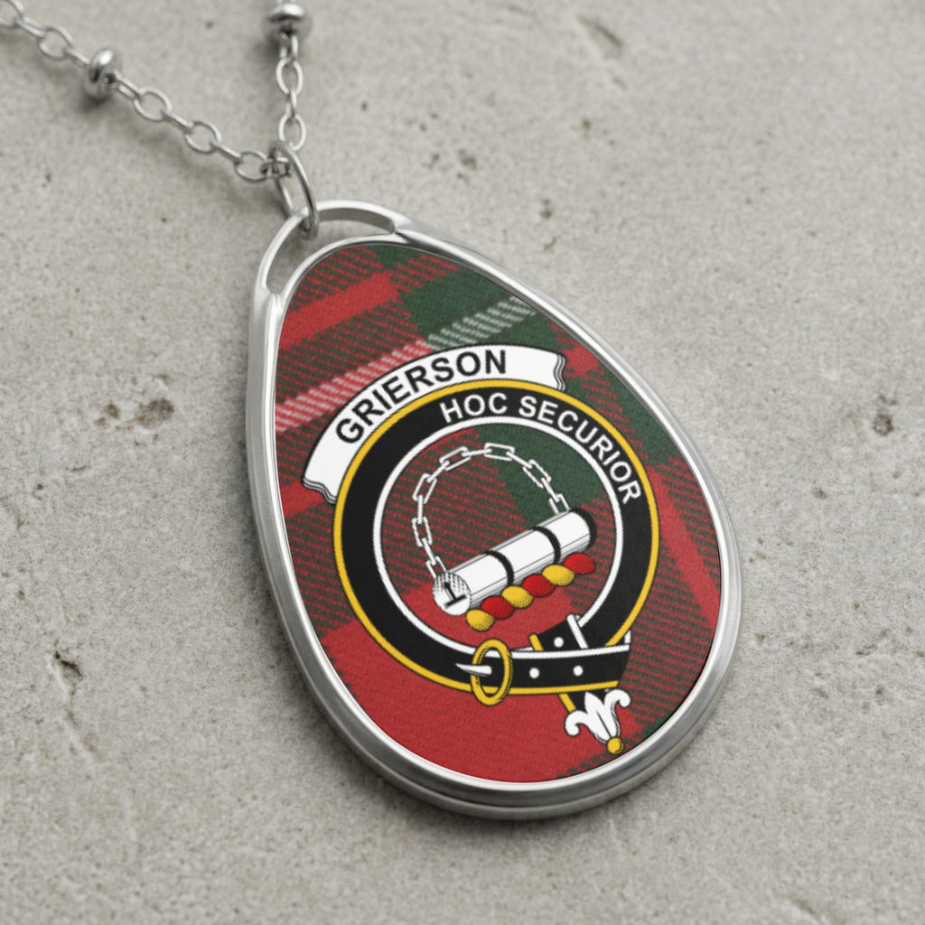 Grierson clan Scottish tartan necklace with clan crest and Hoc Securior motto on tartan background