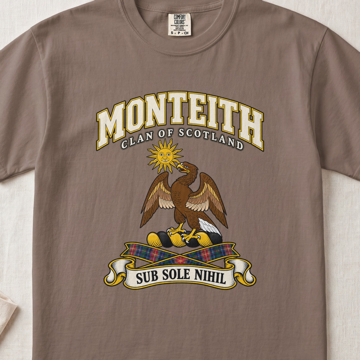 Monteith Scottish clan T-shirt in Espresso, front view with an eagle beneath a golden sun and motto design.