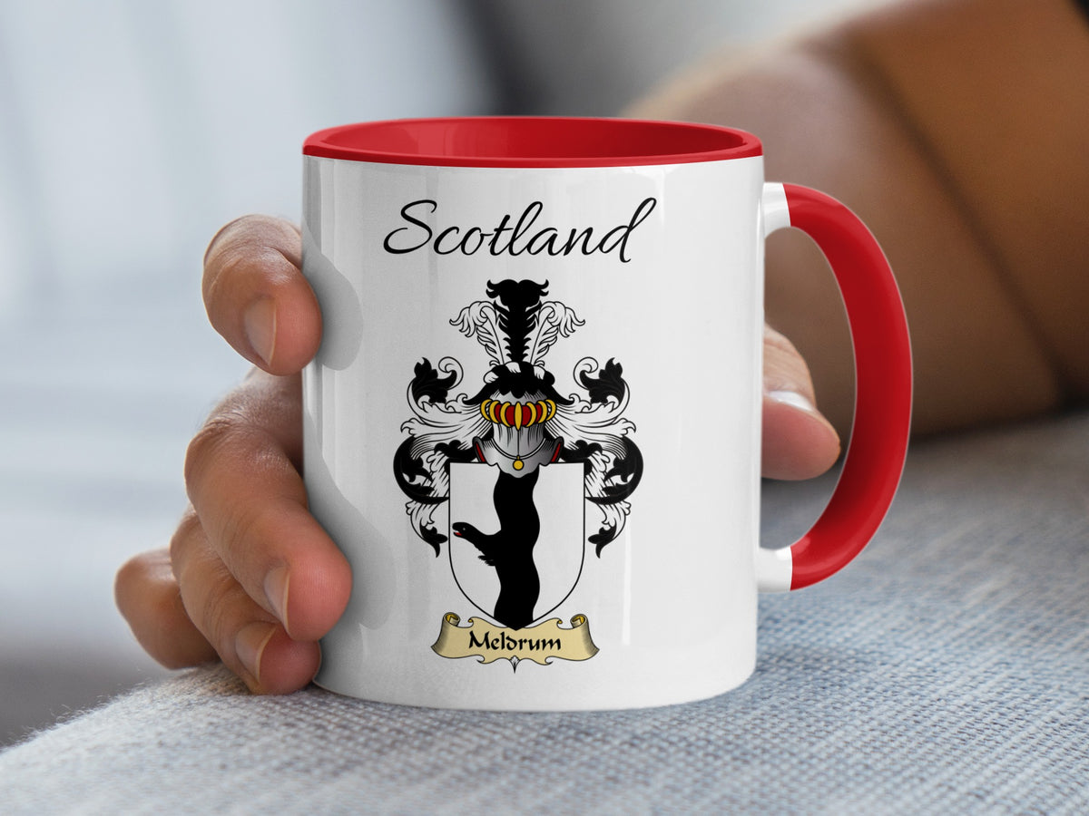 Meldrum Scotland family shield accent mug with red handle and interior, shown in the 11 oz size