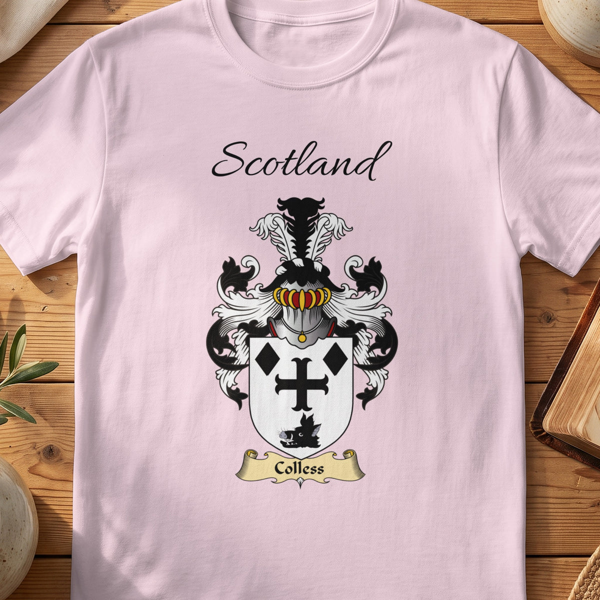 Light Pink Colless Scottish family shield T-shirt featuring a black cross and diamond motifs on white