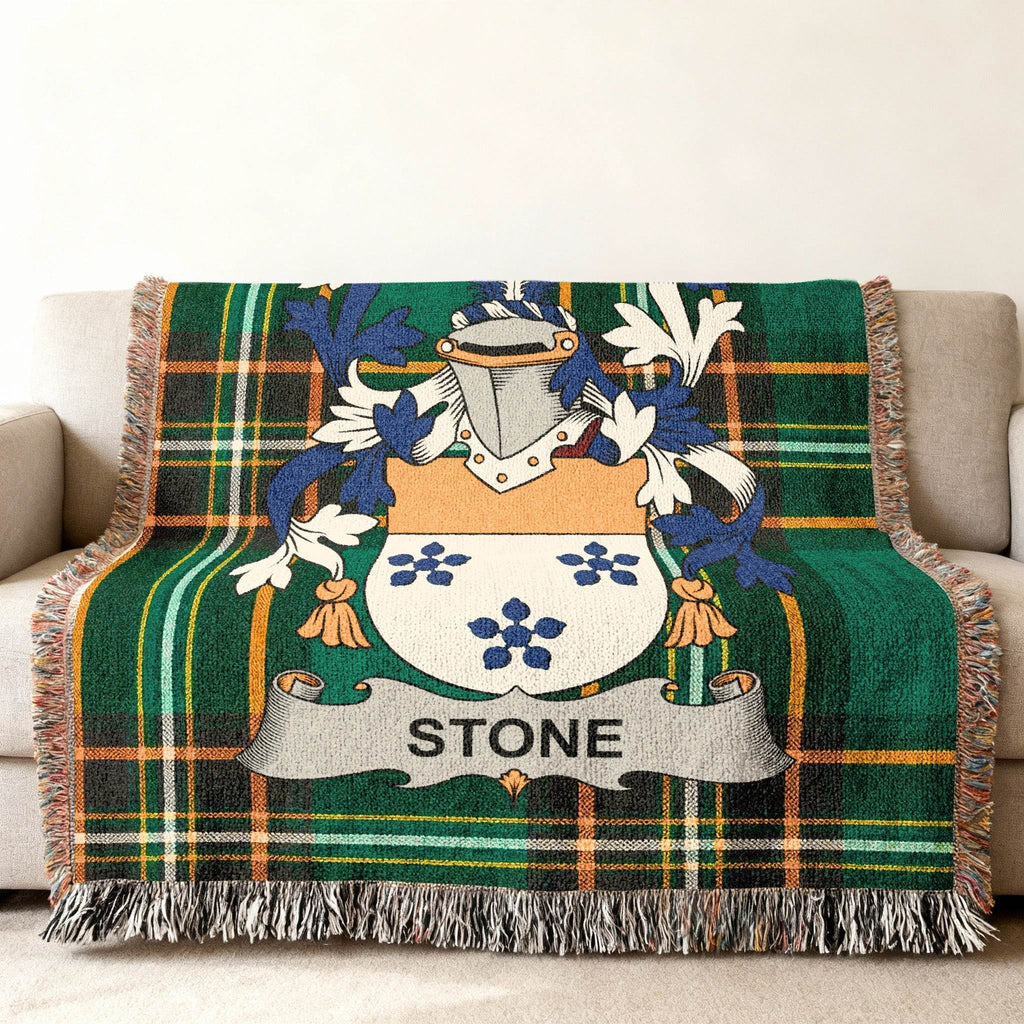 Green tartan throw blanket with the Stone family crest.