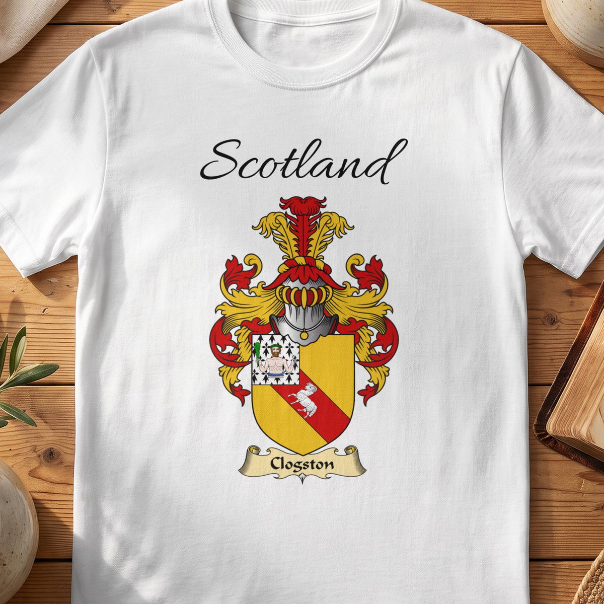 White Clogston Scottish family shield T-shirt featuring a red diagonal band on gold with a patterned corner
