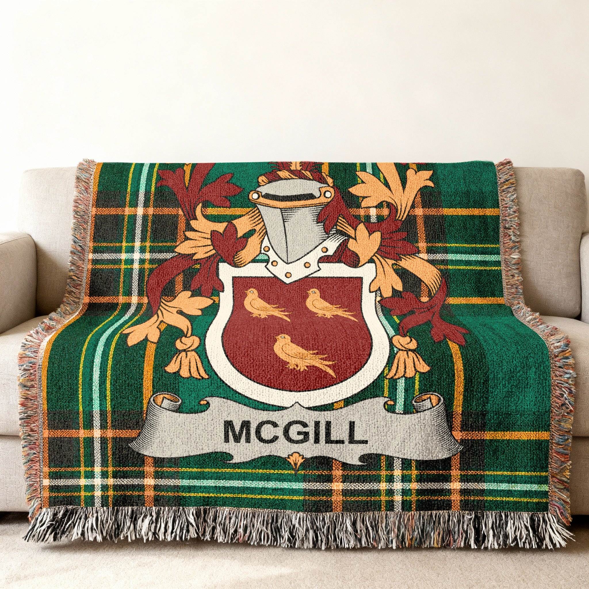 McGill tartan throw blanket with a coat of arms on a couch.