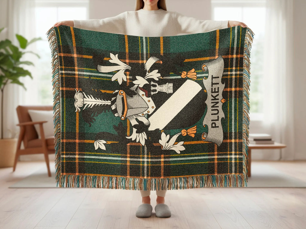Tartan blanket with Plunkett family crest and fringe.