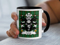 White mug with black handle featuring a coat of arms and "Long" on a green plaid background.