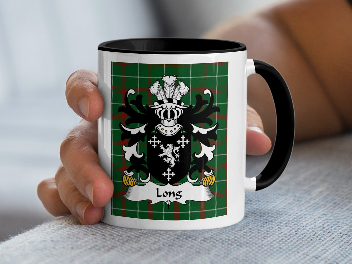 White mug with black handle featuring a coat of arms and "Long" on a green plaid background.
