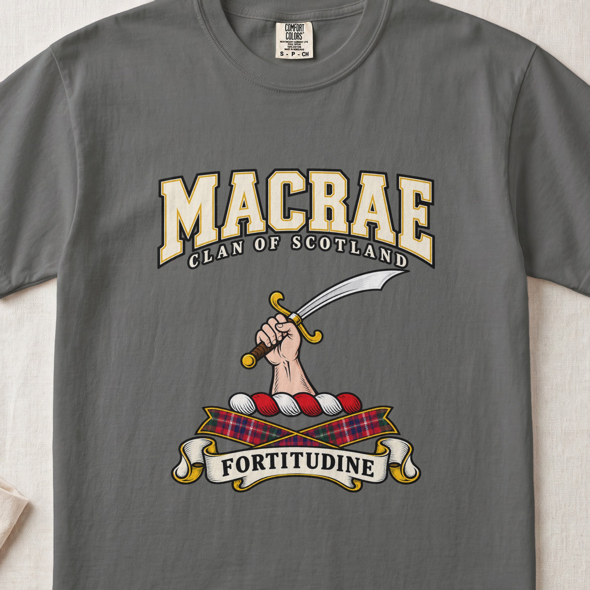 MacRae graphic T-shirt in Pepper gray, front flat lay showing varsity lettering and hand and forearm holding a curved silver sword with a gold hilt.