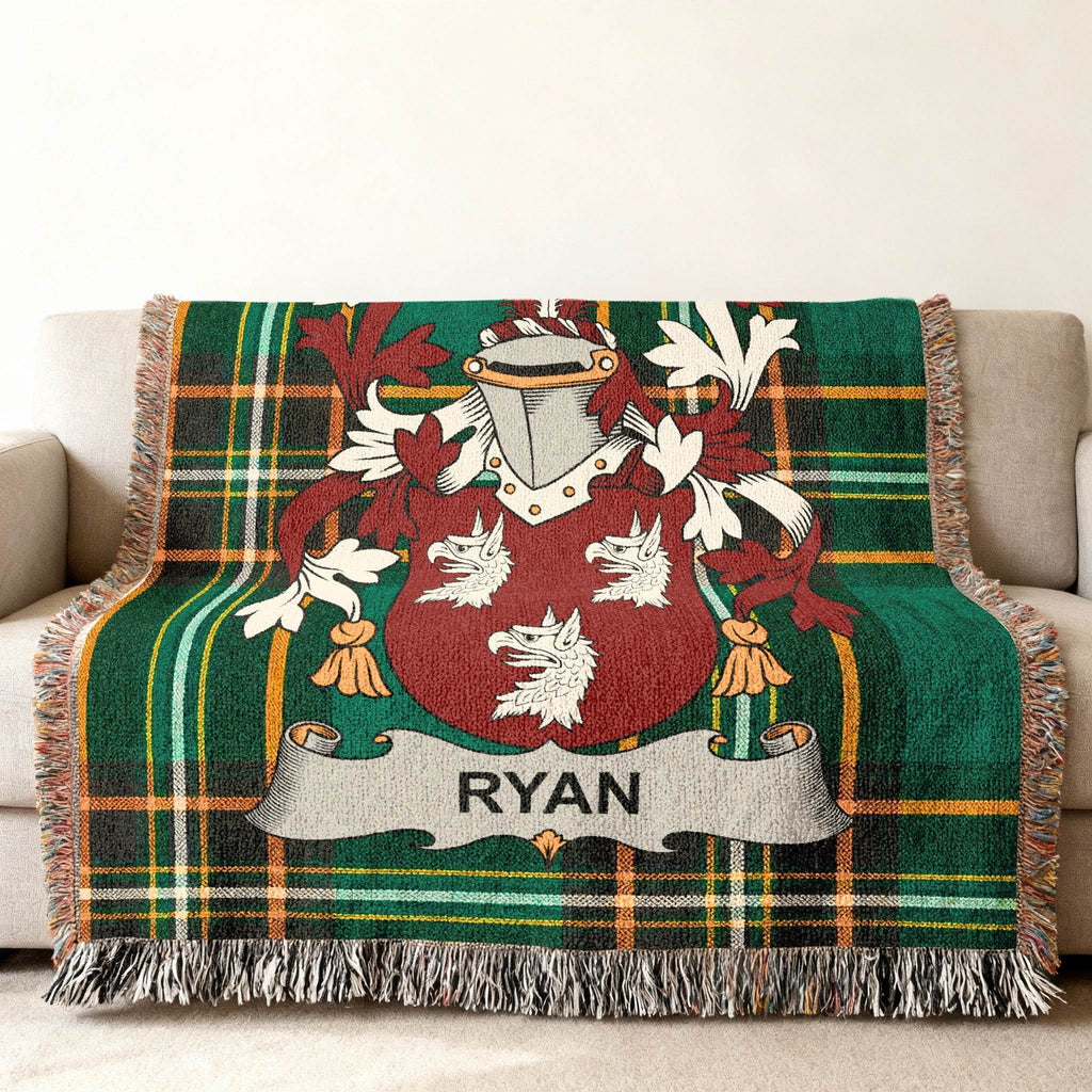 Woven tartan throw blanket featuring the Ryan family crest in the center.