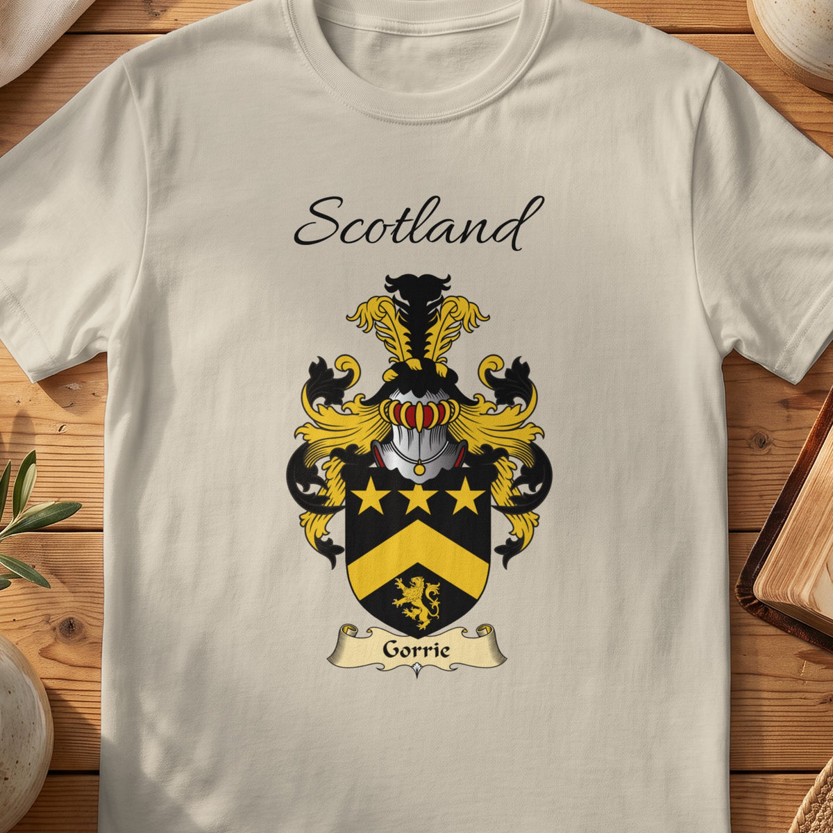 Sand Gorrie Scottish family shield T-shirt featuring gold stars and a gold chevron on black
