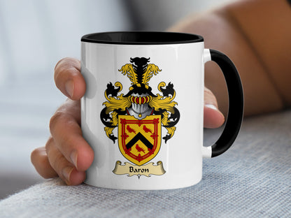 White mug with black handle featuring a coat of arms with the name "Baron" below.