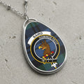 Baird clan Scottish tartan necklace with clan crest on tartan background