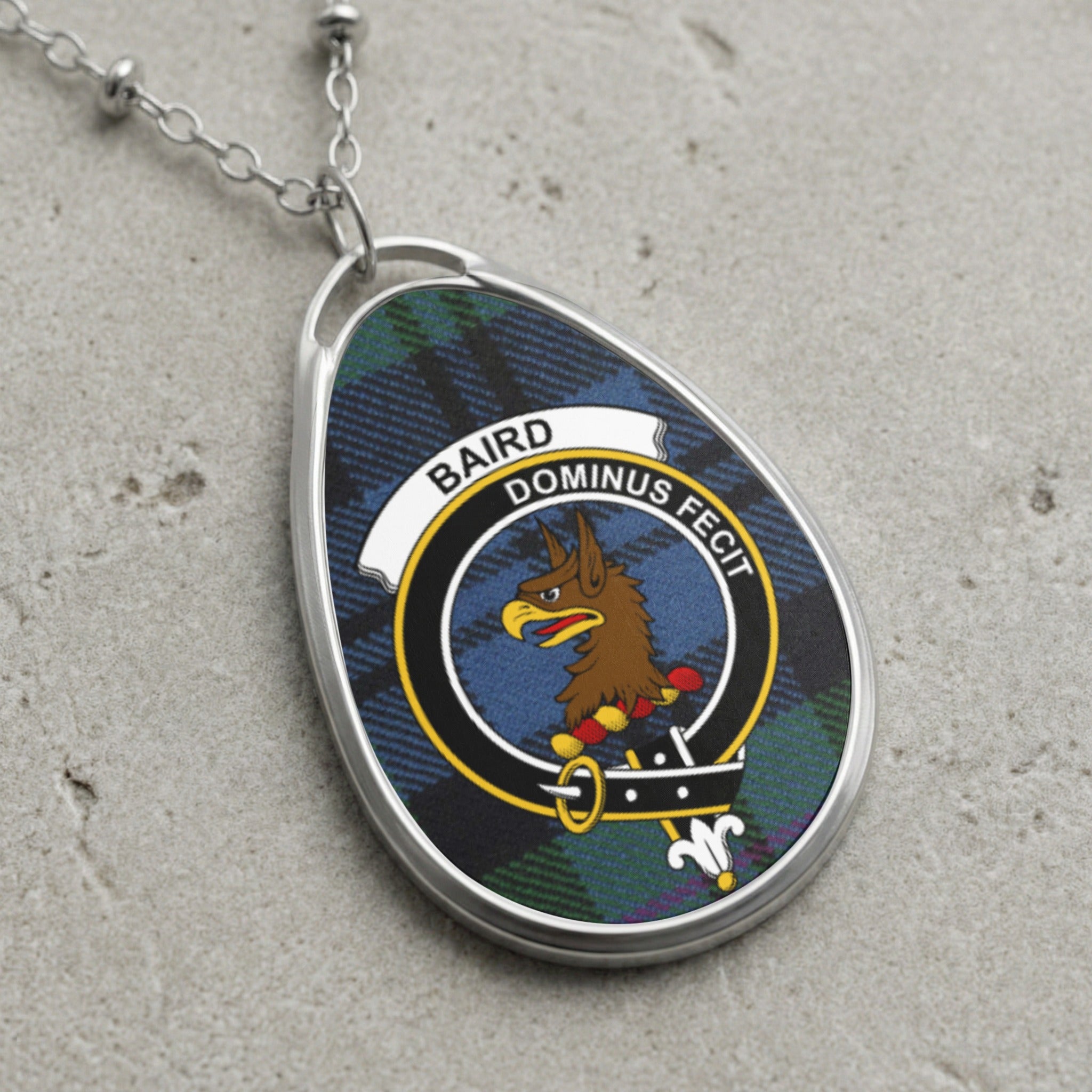 Baird clan Scottish tartan necklace with clan crest on tartan background