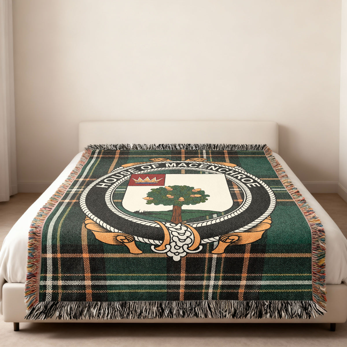 MacEnroe family crest emblem woven blanket displayed on a bed