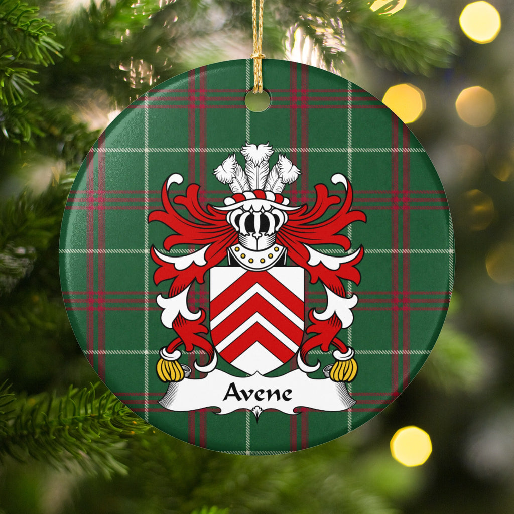 Avene ornament among Christmas tree branches and warm lights; three red chevrons on a white shield on Welsh national tartan.