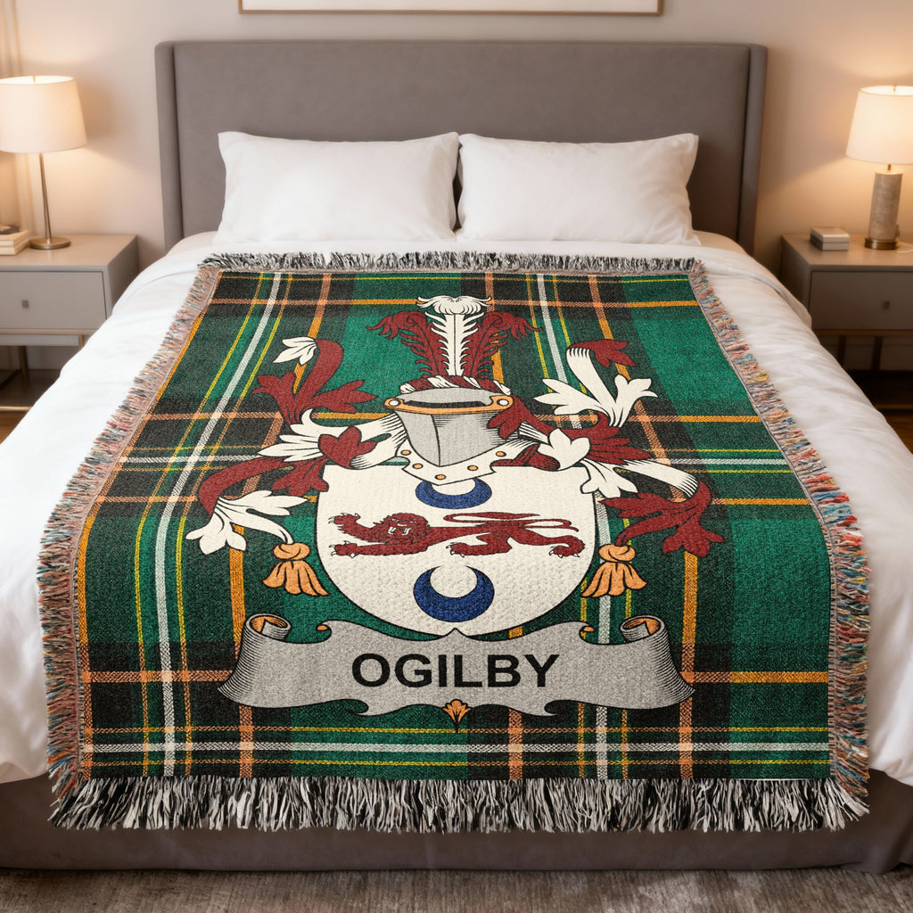 Ogilvy tartan blanket with coat of arms displayed on a bed.