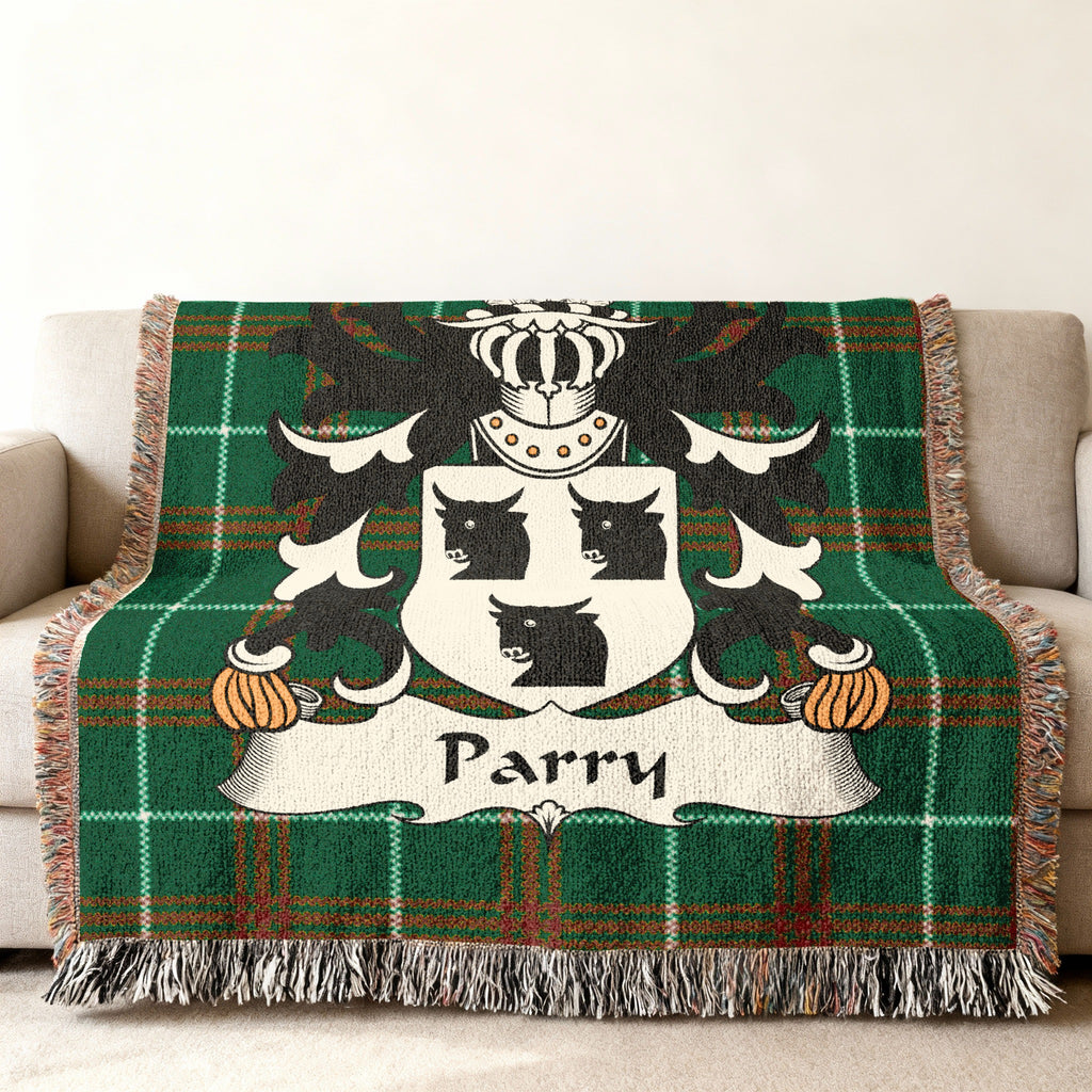 Green tartan throw blanket with the Parry family crest.