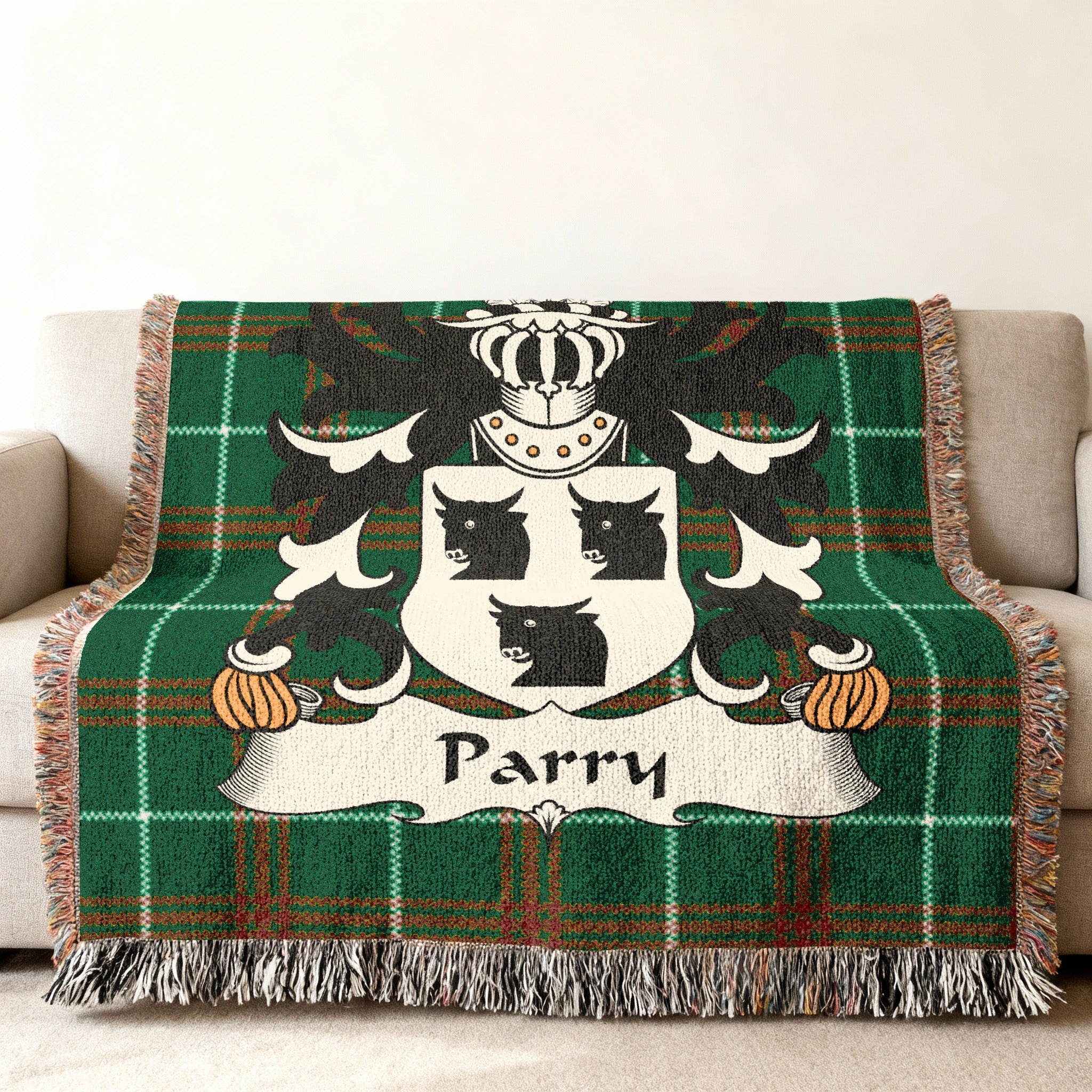Green tartan throw blanket with the Parry family crest.