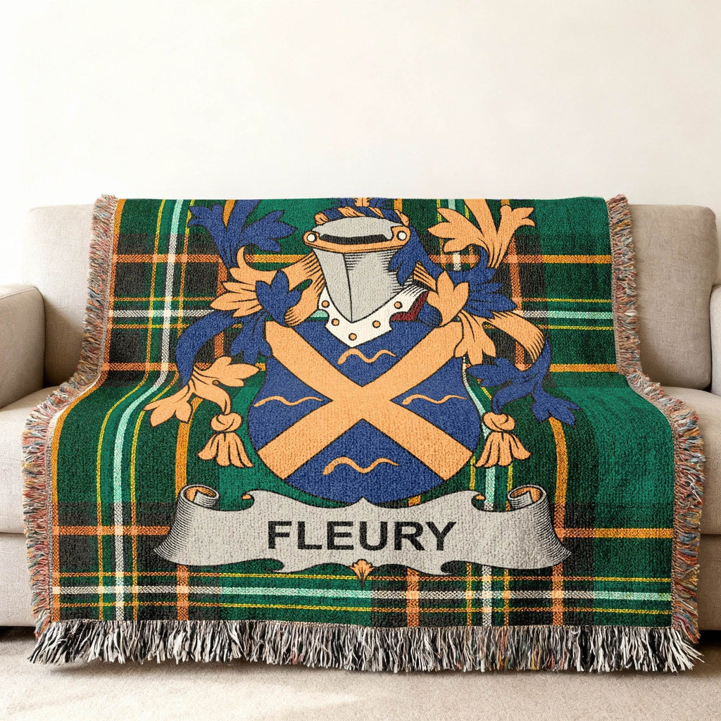 Tartan blanket featuring a blue and gold crest with the name FLEURY on a banner.