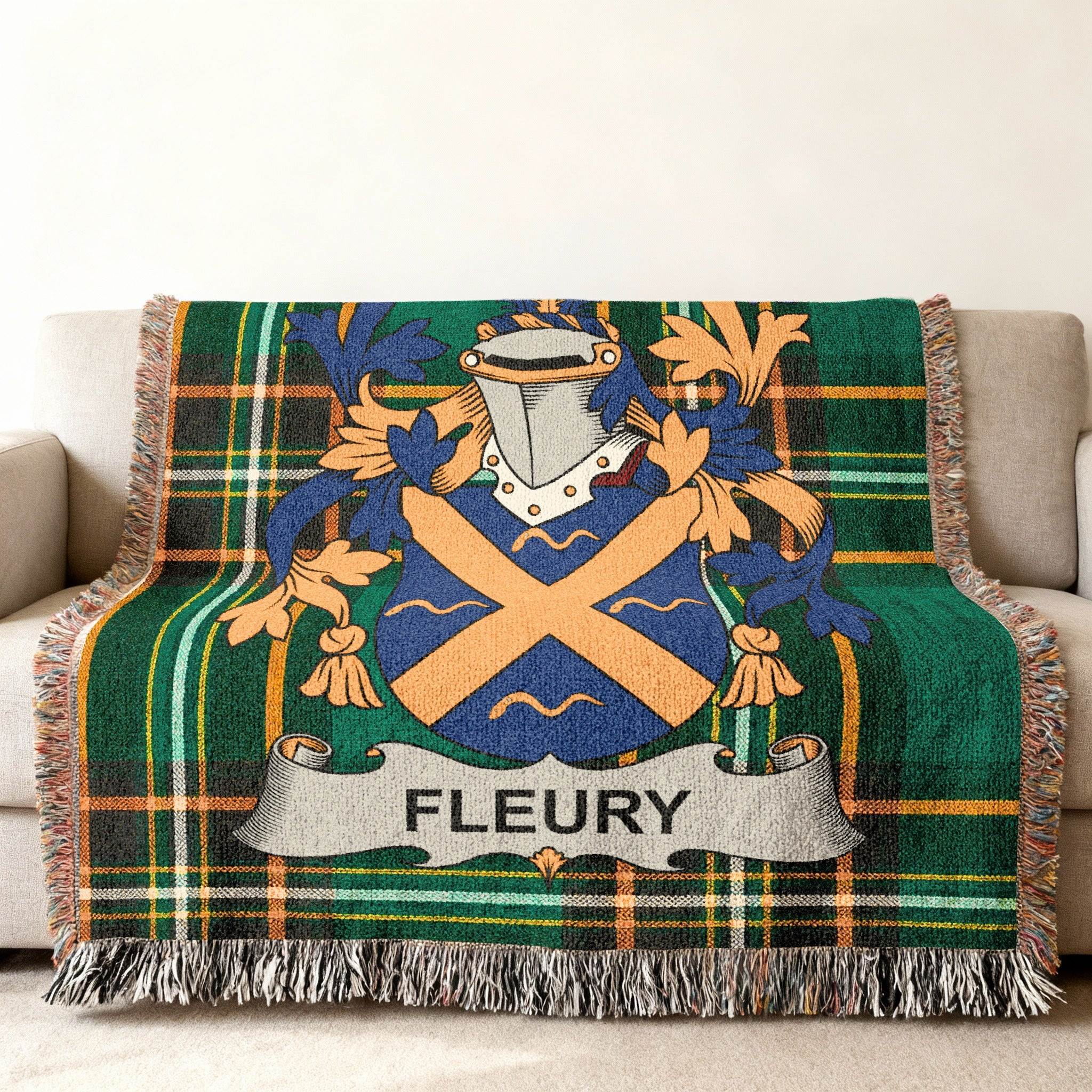 Tartan blanket featuring a blue and gold crest with the name FLEURY on a banner.