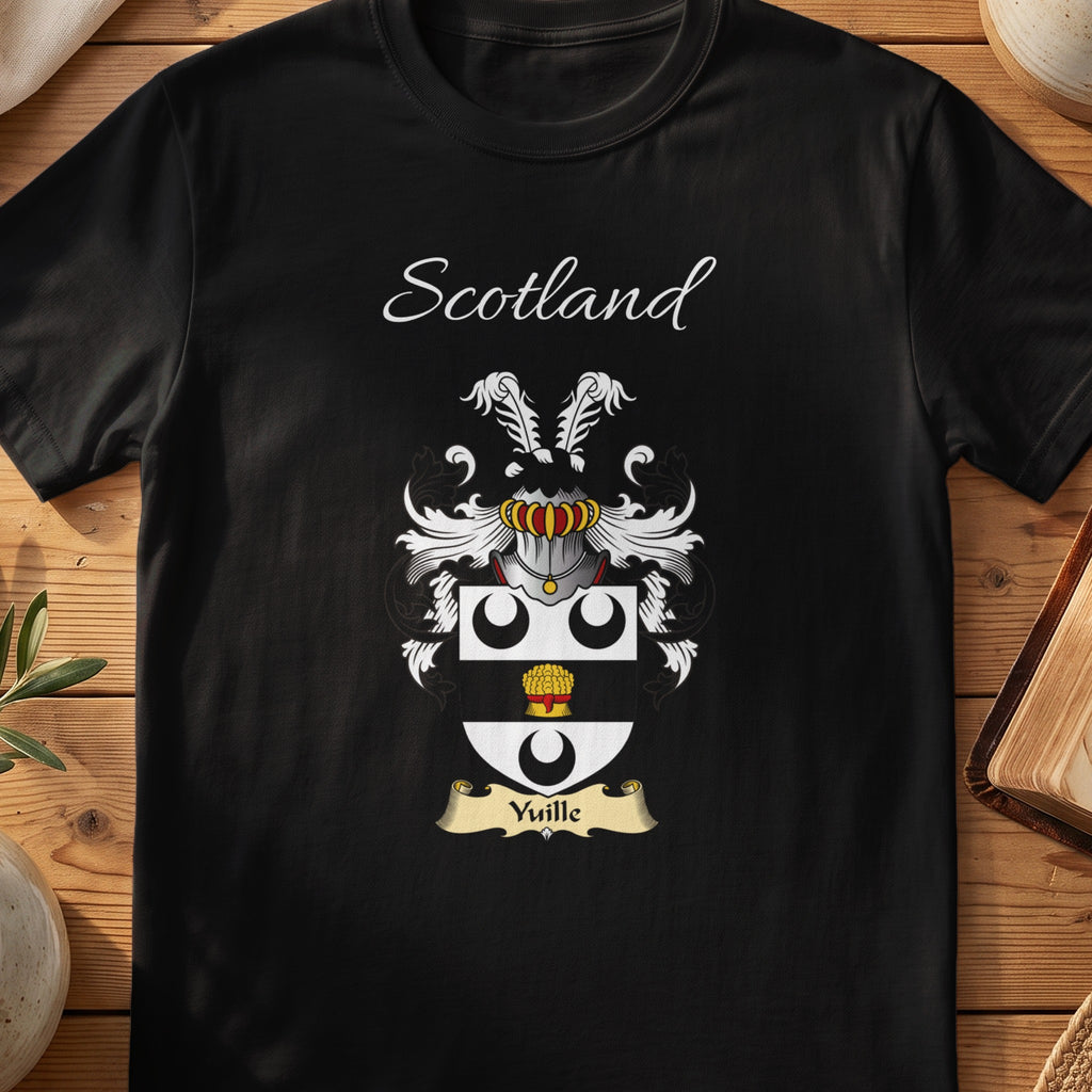 Black Yuille Scottish family crest T-shirt laid flat, showing “Scotland” above a black-and-silver shield with crescents and a gold roundel.