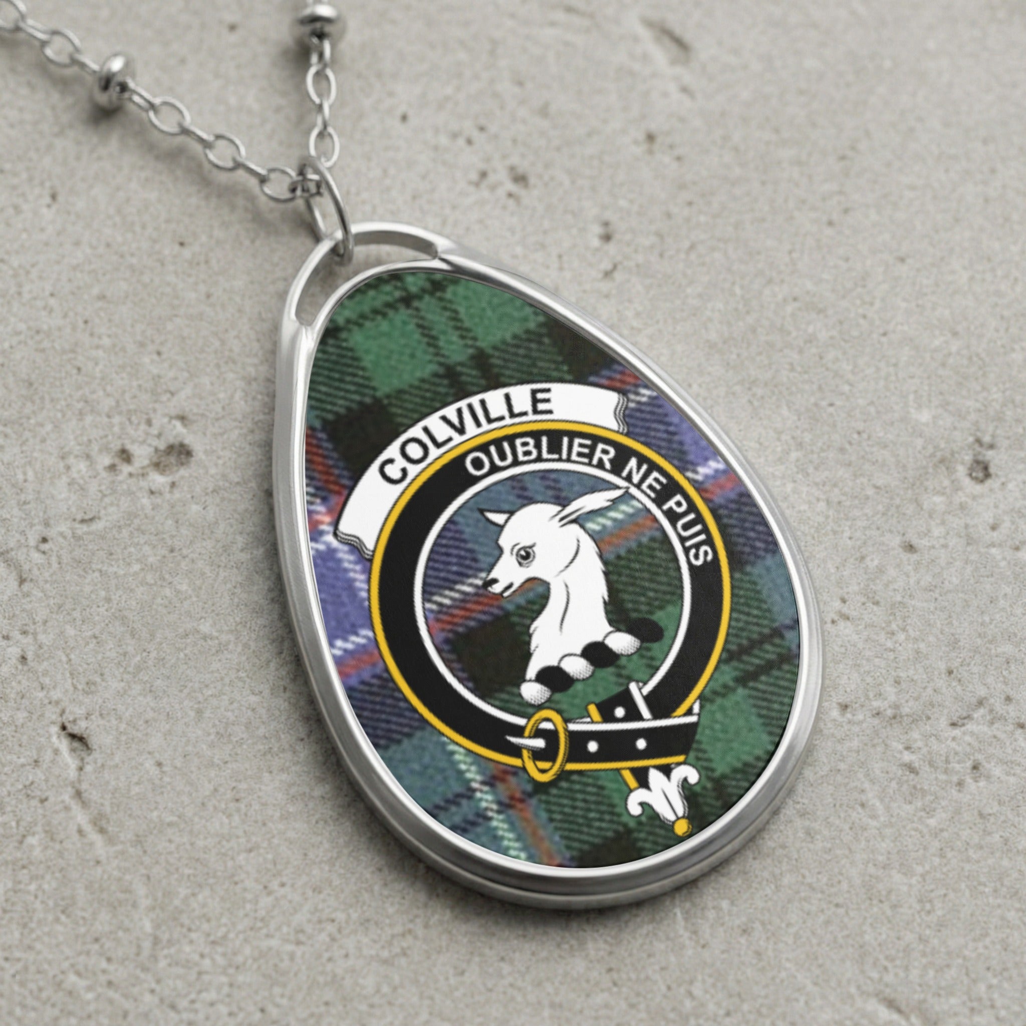 Colville clan Scottish tartan necklace with clan crest and Oublier Ne Puis motto on tartan background
