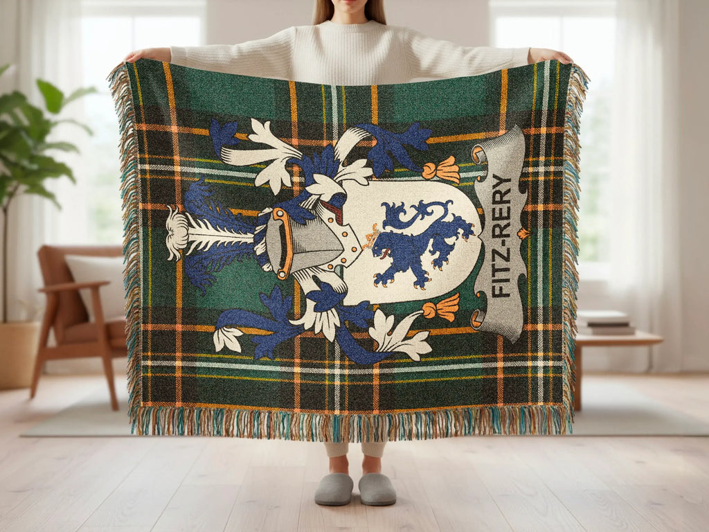 Tartan blanket with Fitz-Rery crest held by person.