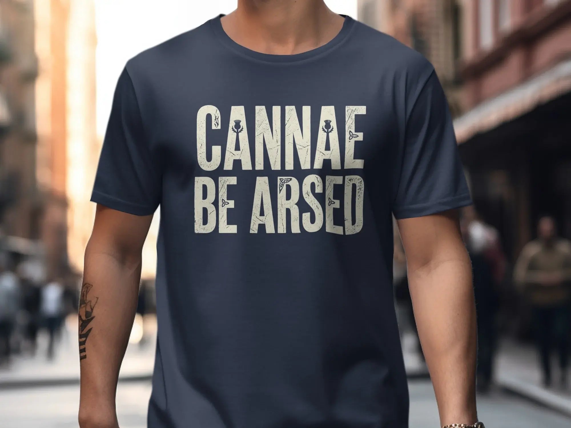 Navy t-shirt with "CANNAE BE ARSED" in distressed white lettering.