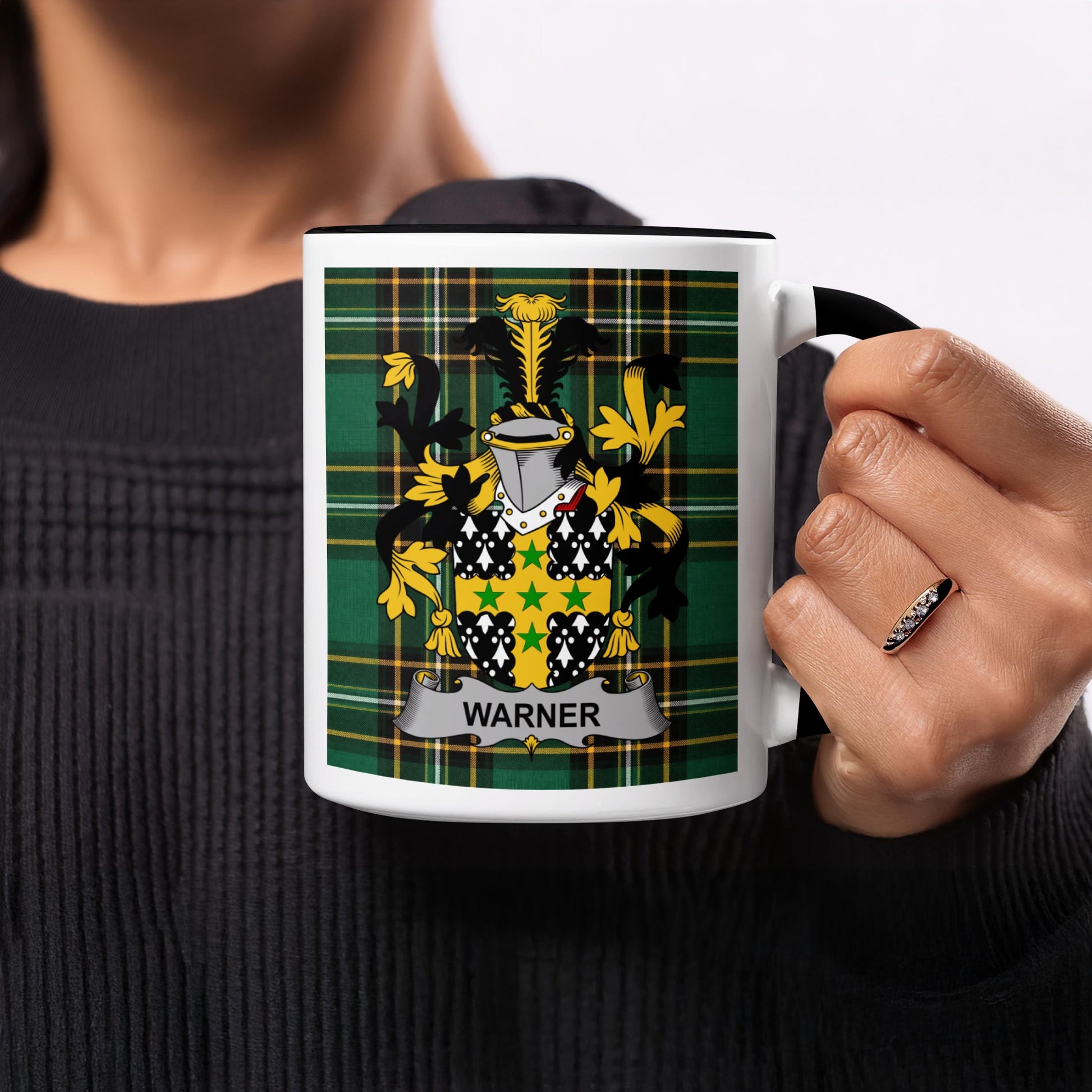Mug with Warner family crest on tartan background.