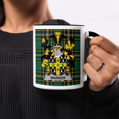 Mug with Warner family crest on tartan background.
