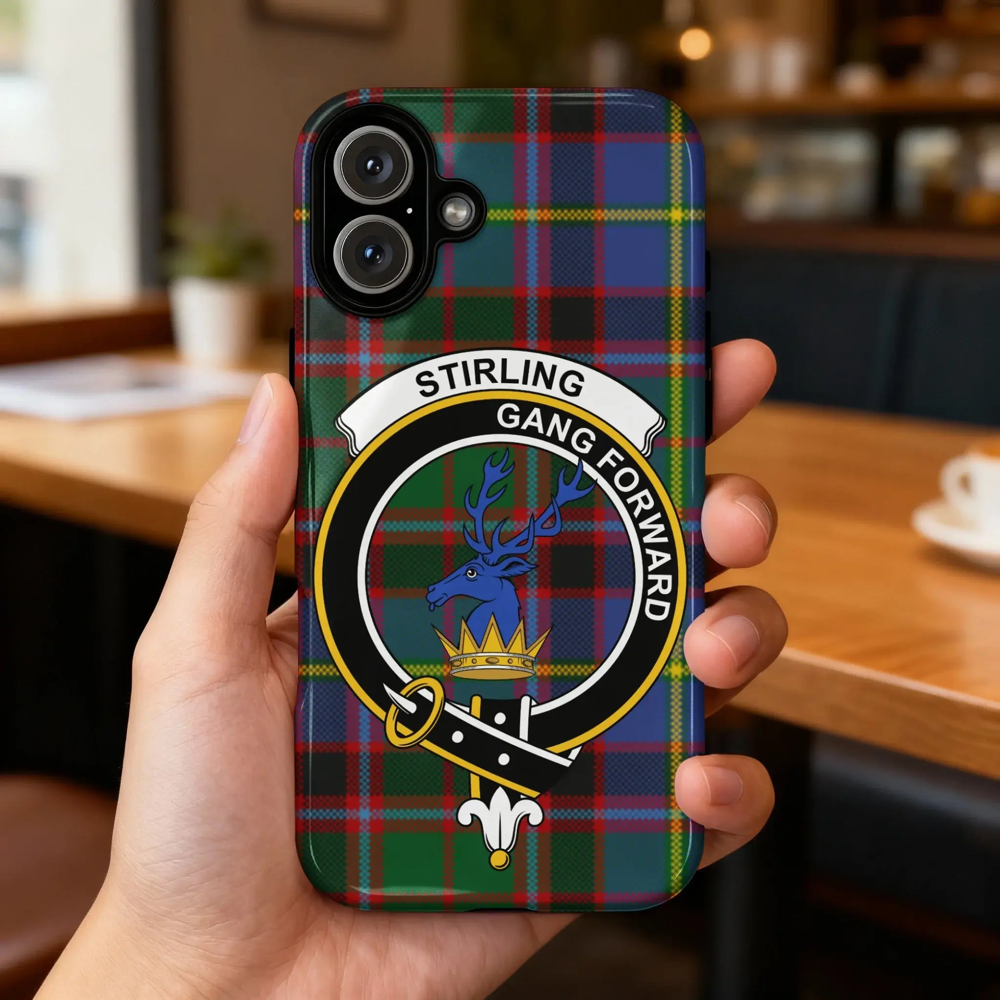 Clan Stirling gang forward tartan phone case — glossy edge-to-edge stag crest print, iPhone shown