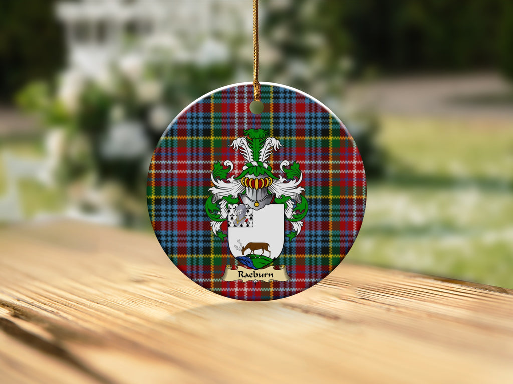 Round Raeburn Scottish clan ornament with family crest on a Caledonia tartan background
