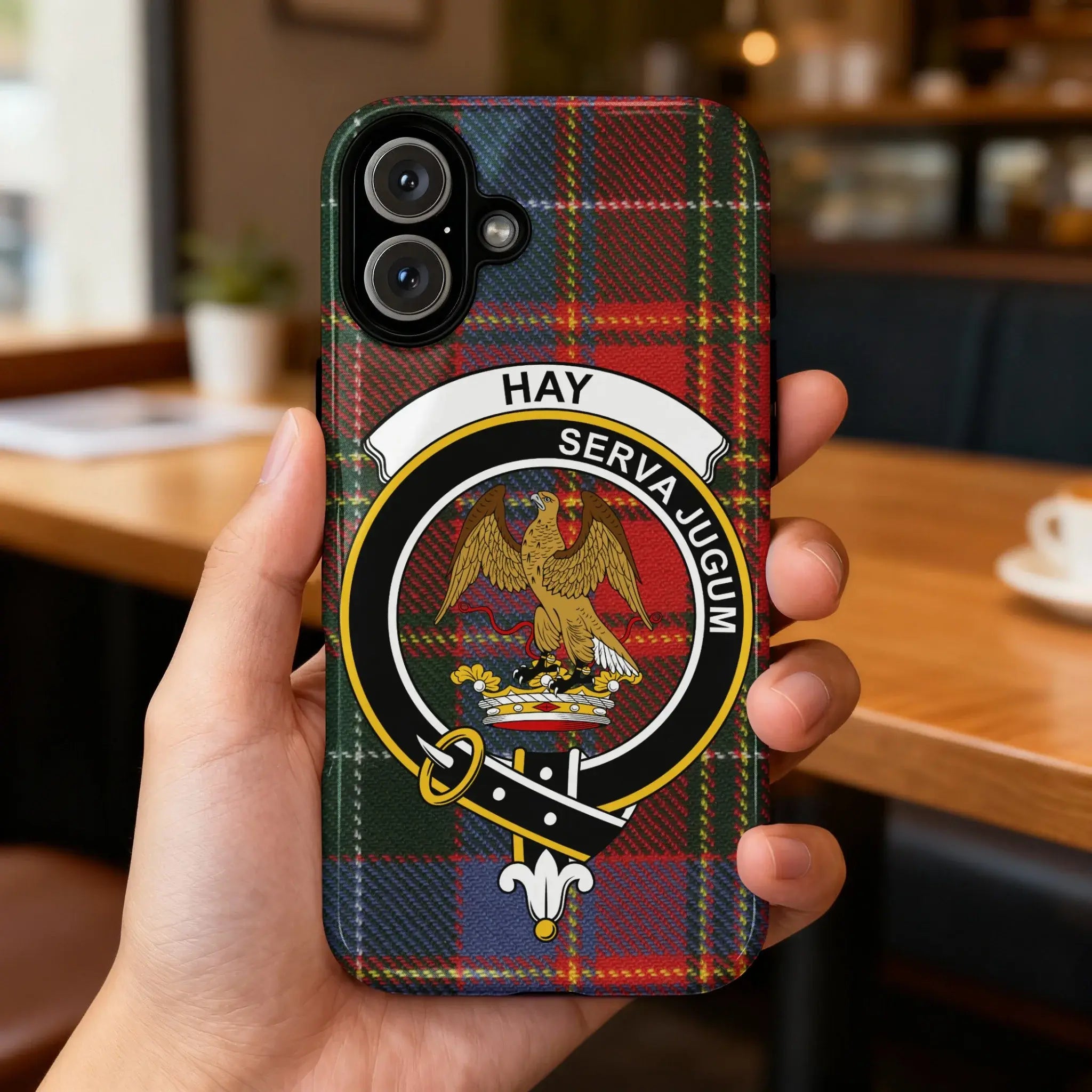 Hay Serva Jugum plaid design phone case flat lay — full eagle clan crest tartan design visible