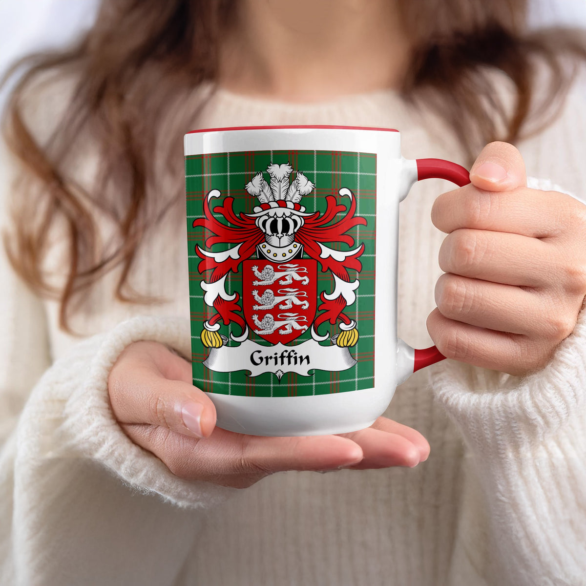 White mug with red trim, featuring the Griffin crest on a tartan background.