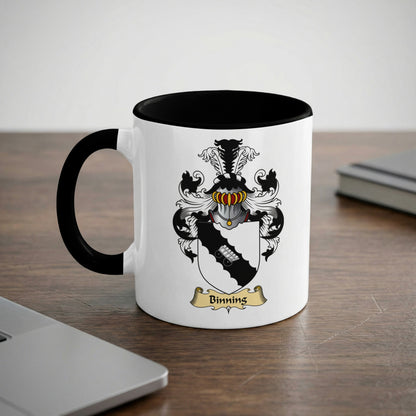 White mug with black rim featuring the Binning family crest and name.