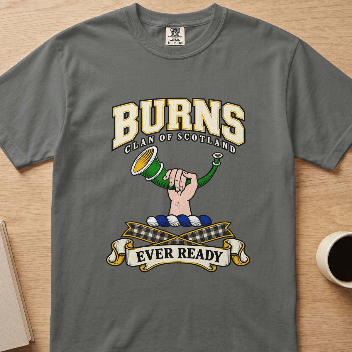 Burns clan T-shirt in gray, front view with hand holding a green hunting horn