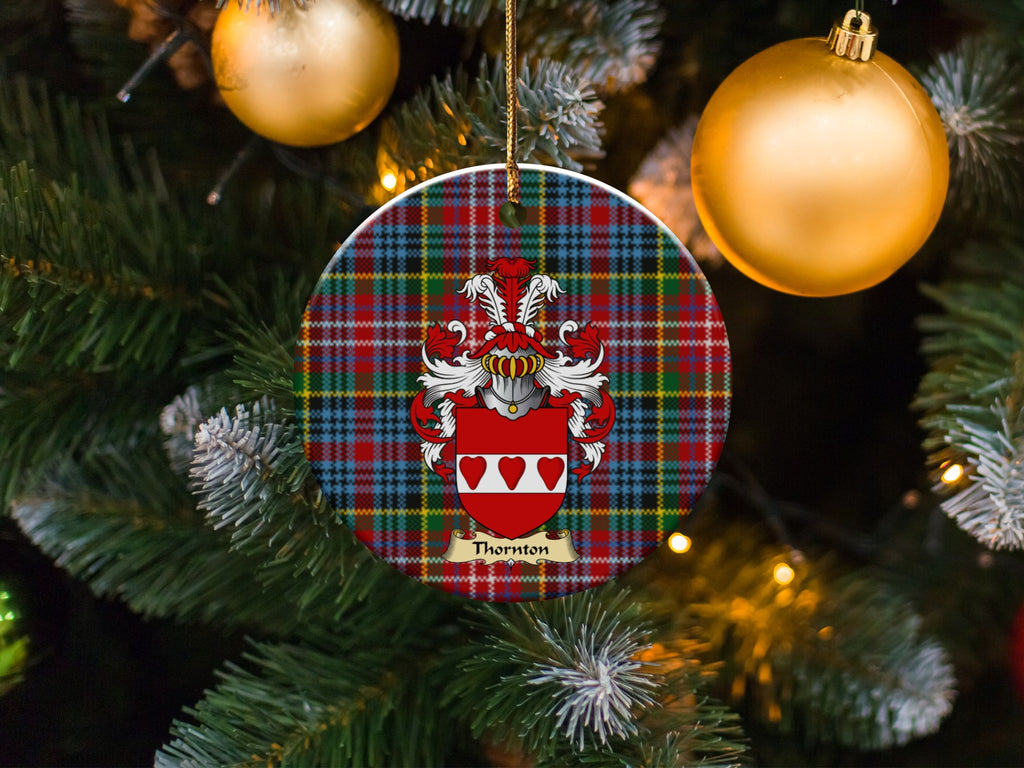 Thornton family emblem ceramic Christmas ornament with Caledonia tartan background in festive holiday décor