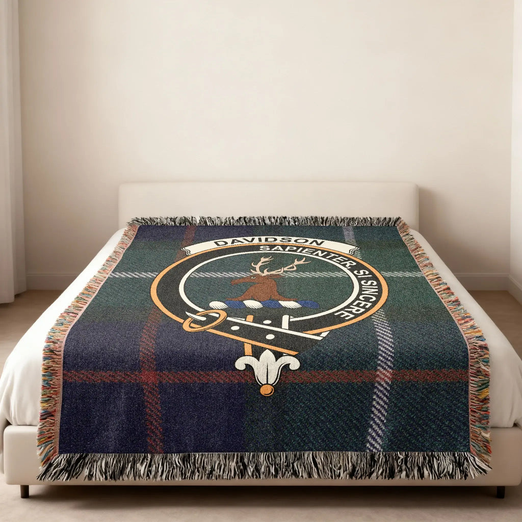 Davidson clan crest tartan woven blanket — heraldic design at centre, fringe edge visible