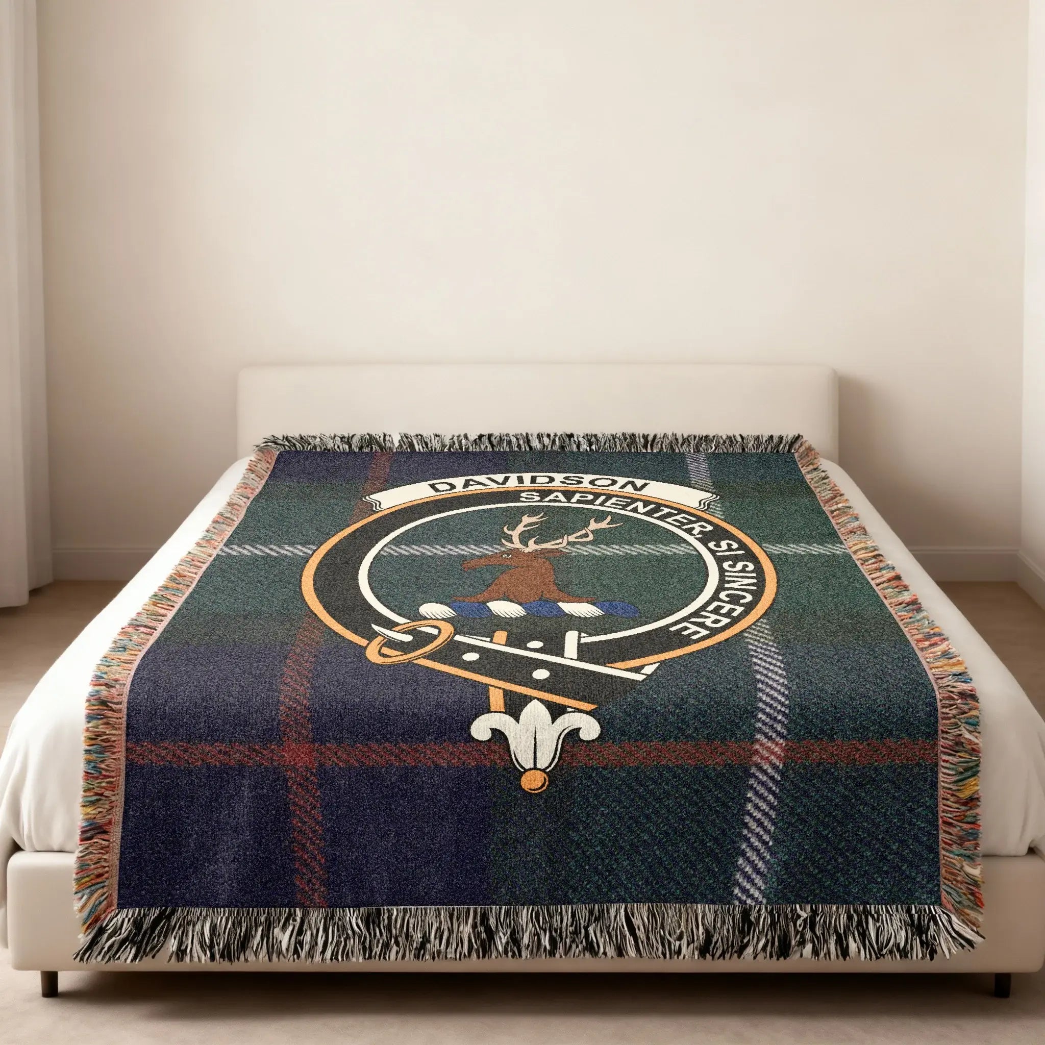 Davidson clan crest tartan woven blanket — heraldic design at centre, fringe edge visible