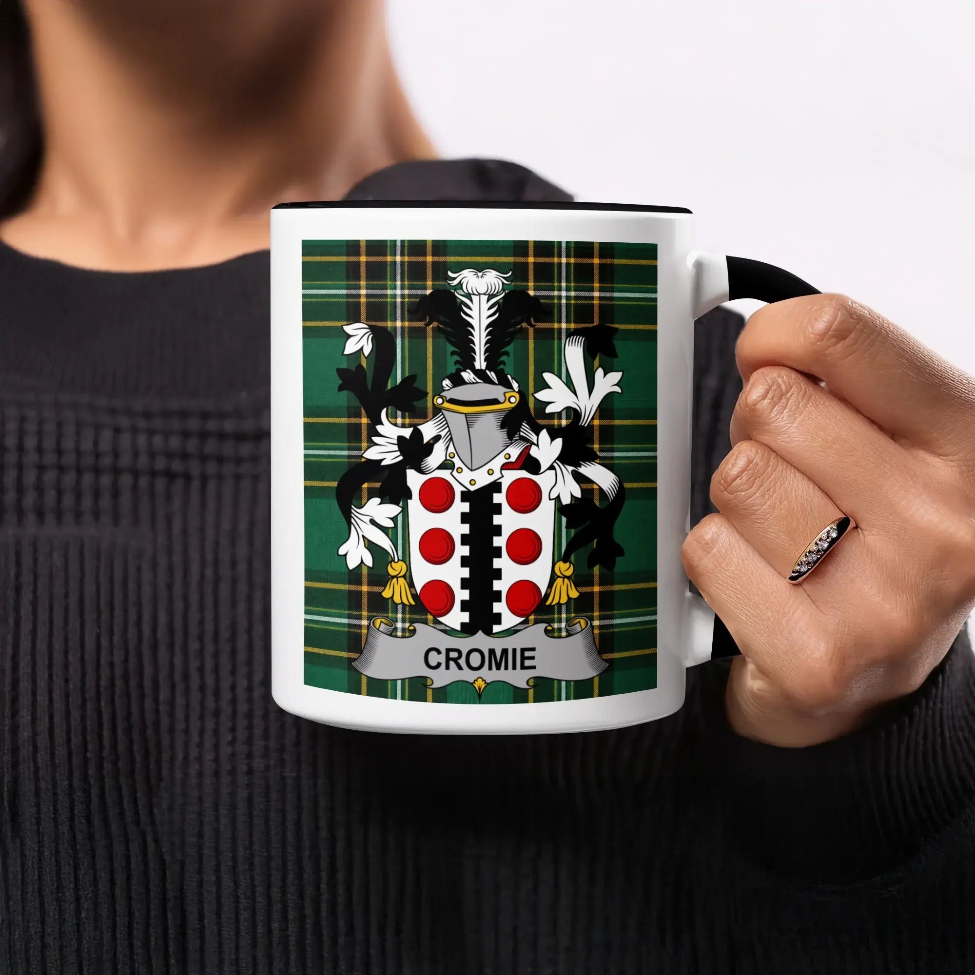 Mug with Cromie coat of arms on green tartan background.