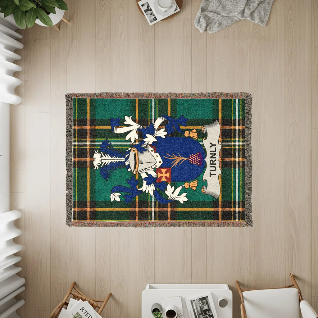 Tartan throw with the Turnly family crest displayed prominently.