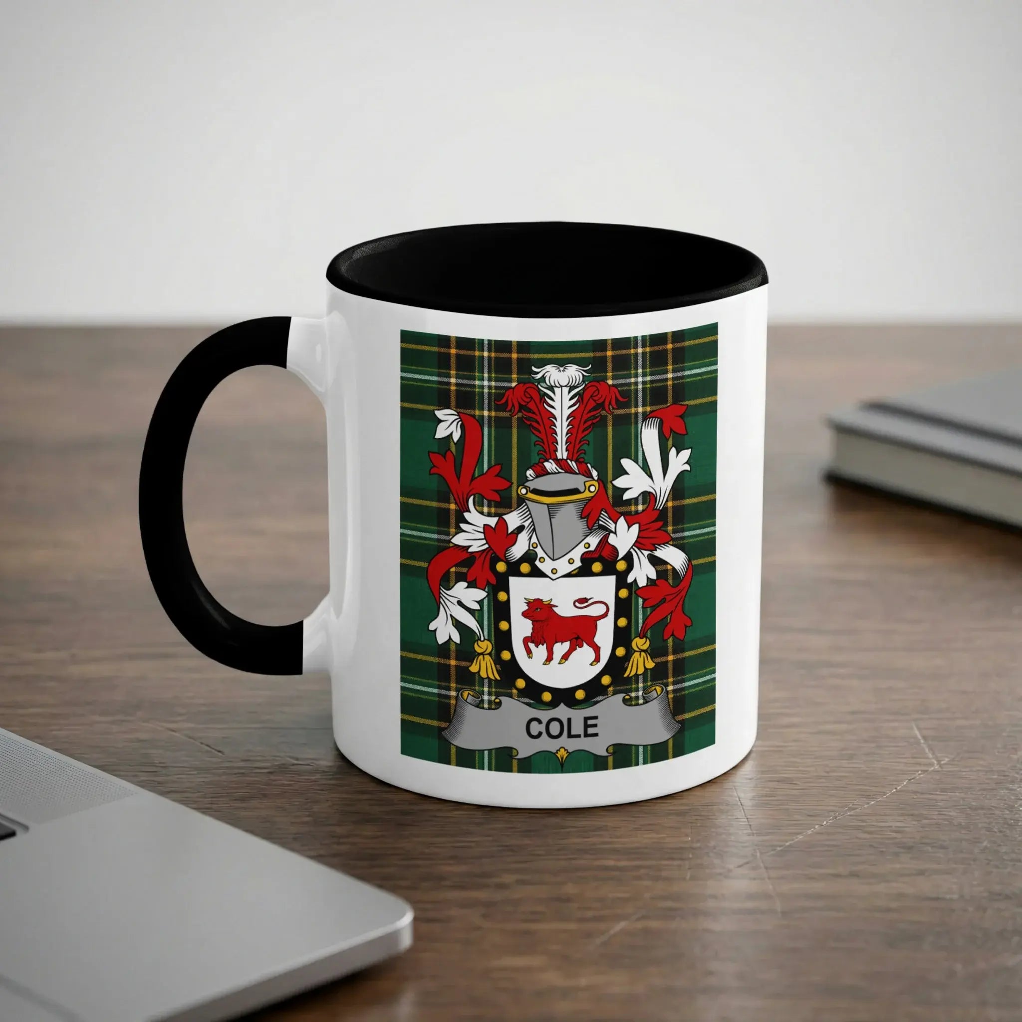 White mug with black rim featuring the Cole family crest on a tartan background.