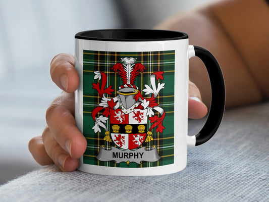 White mug with black handle displaying the Murphy family crest on a tartan background.