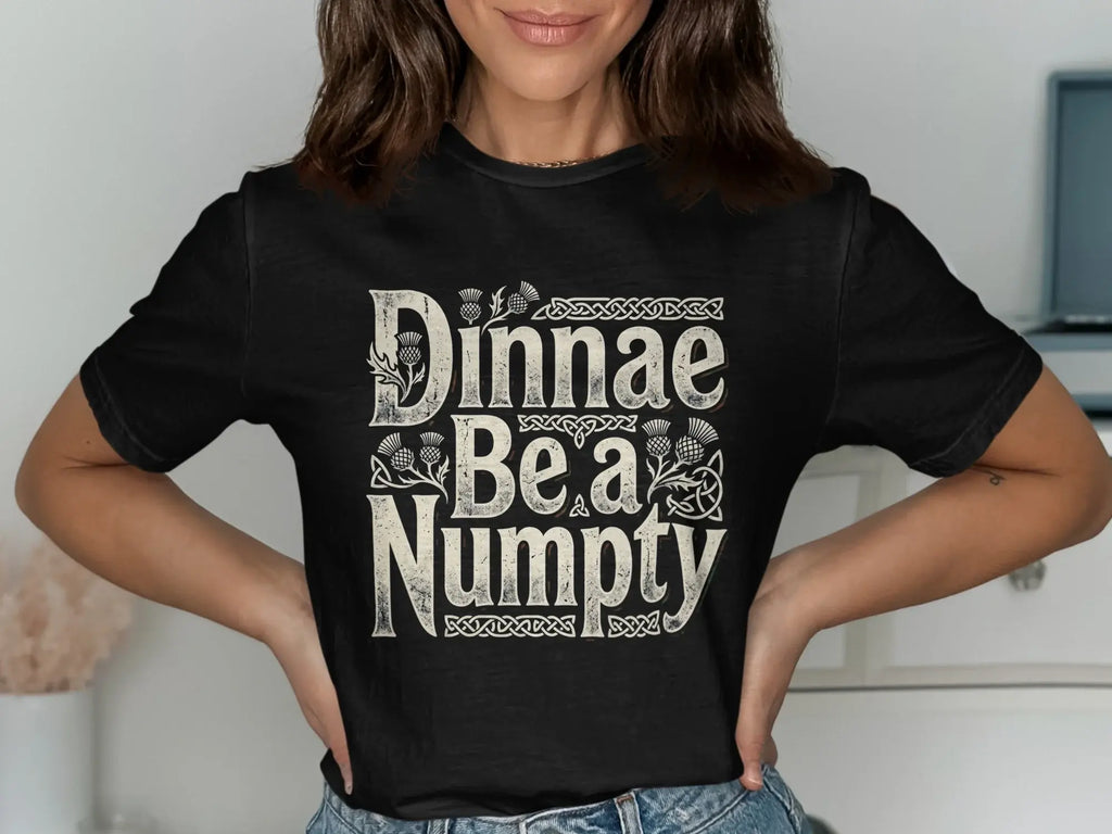 Black t-shirt with "Dinnae Be a Numpty" text and thistle designs.