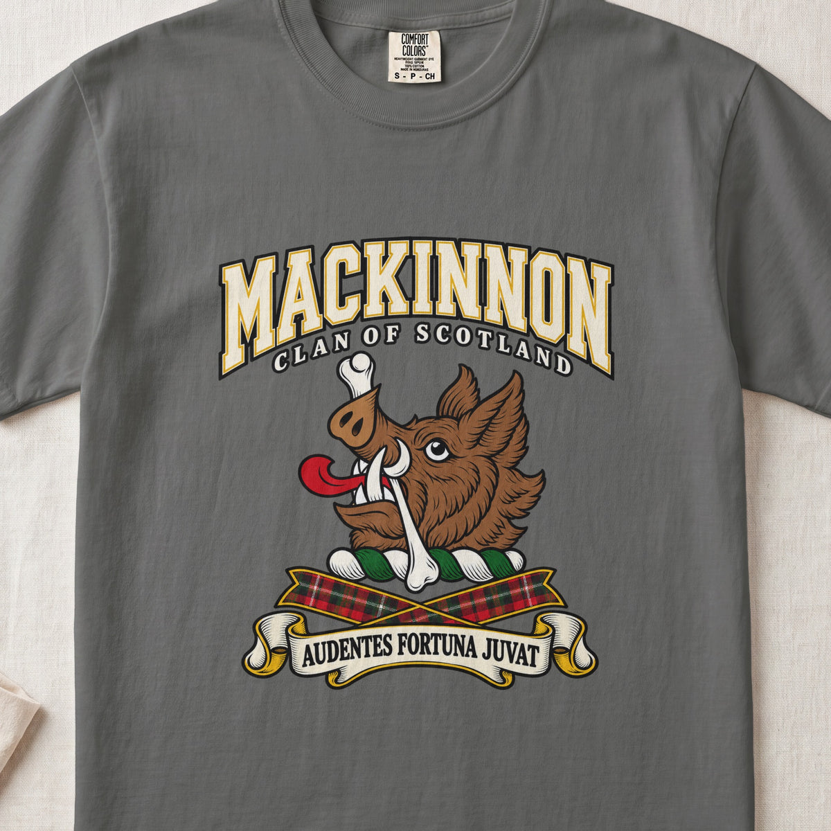 MacKinnon graphic T-shirt in Pepper gray, front flat lay showing varsity lettering and brown boar head with white tusks, red tongue and a white bone.