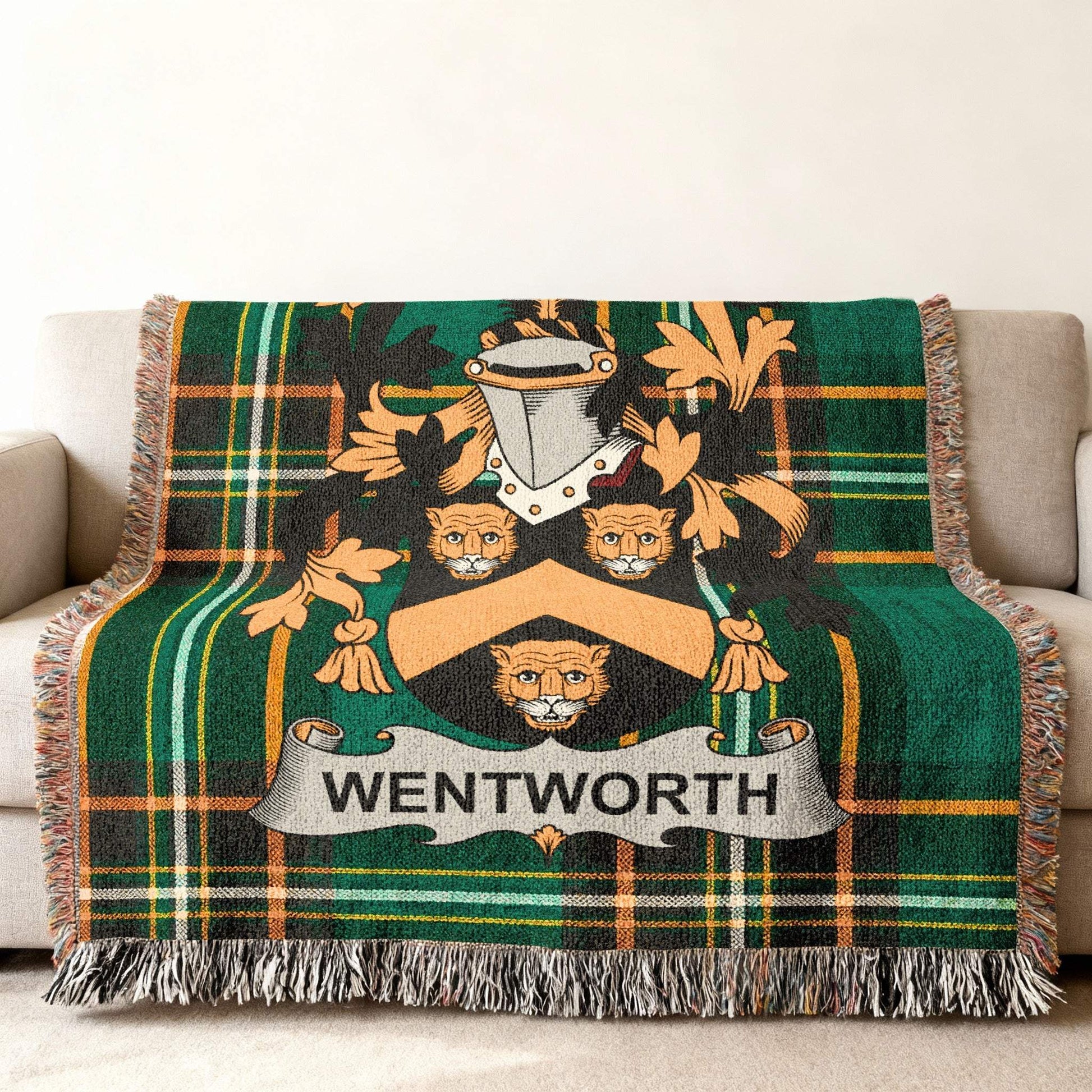Green plaid throw blanket with a Wentworth family crest.