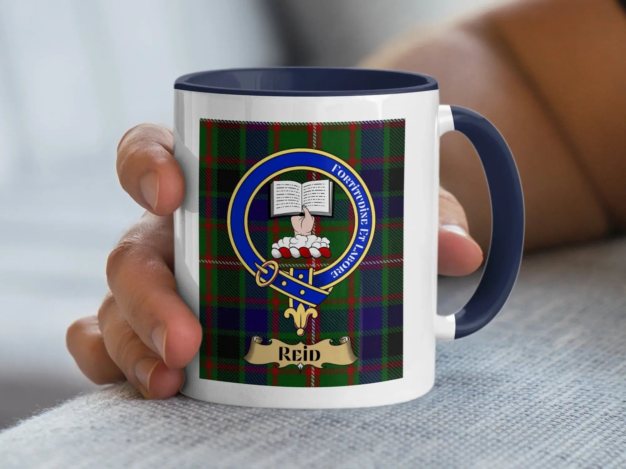 Reid family crest coffee mug with a tartan-background design
