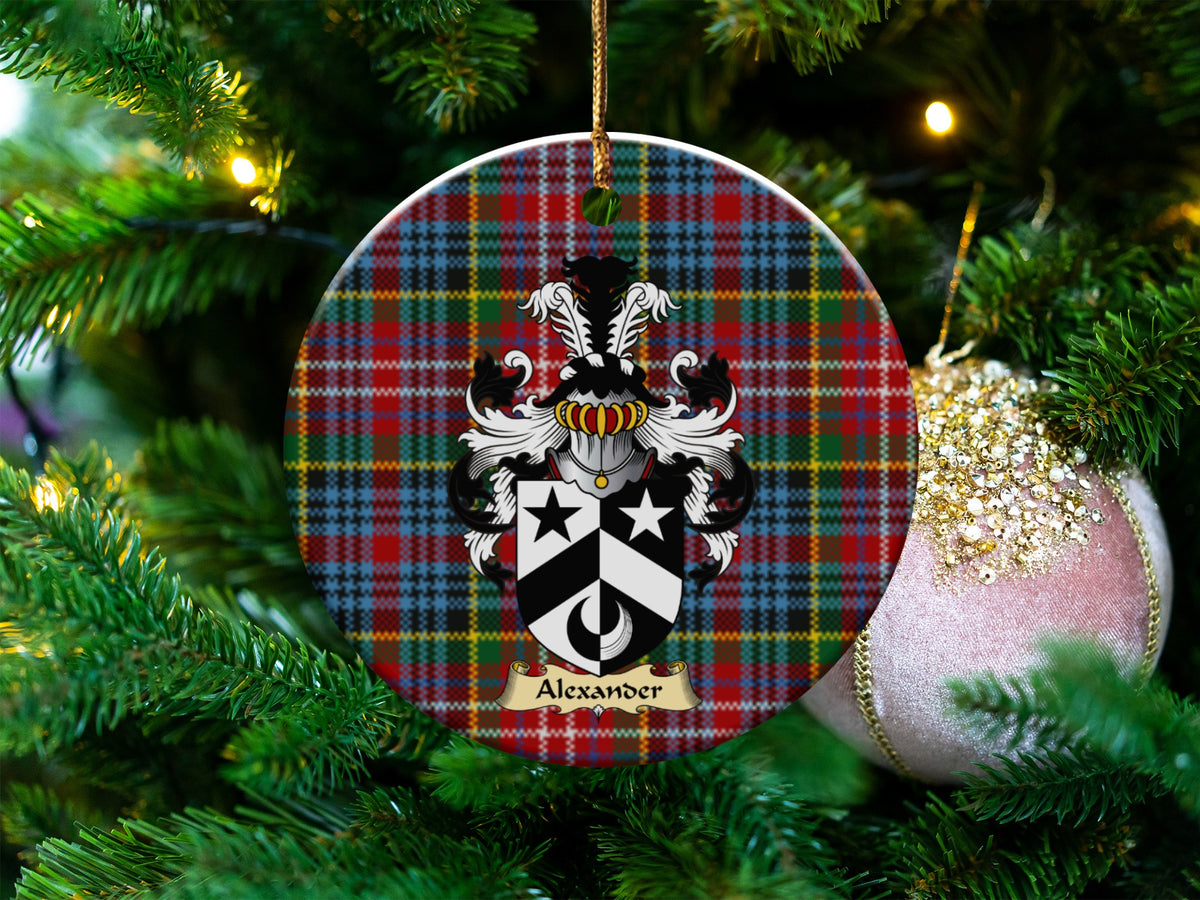Alexander Scottish clan ceramic ornament with family crest on a Caledonia tartan background, hanging on a Christmas tree