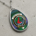 Armstrong clan Scottish tartan necklace with clan crest on tartan background