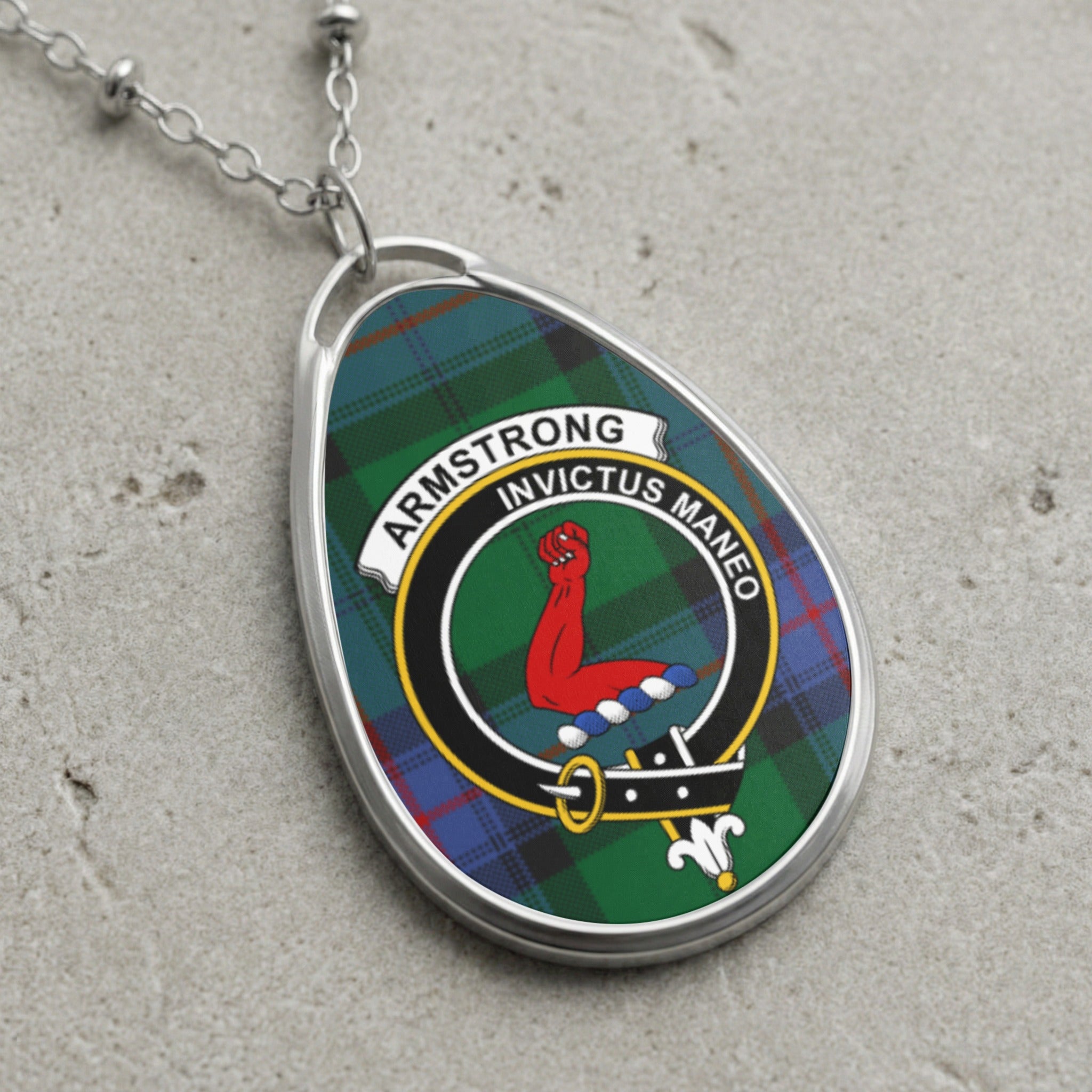 Armstrong clan Scottish tartan necklace with clan crest on tartan background