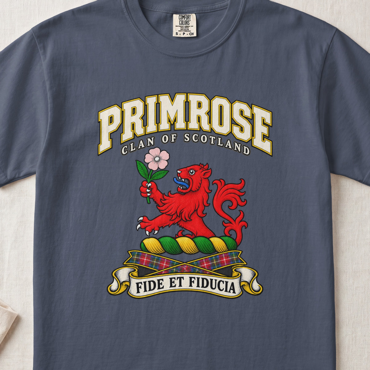 Primrose Scottish clan T-shirt in Midnight, front view with a red lion holding a pink flower and motto design.